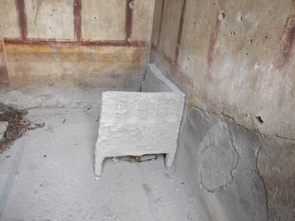 I.9.14 Pompeii. March 2009. Room 13. South west corner, and remains of plaster cast of furniture.