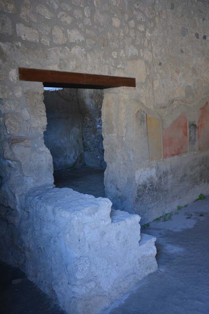 I.10.1 Pompeii. April 2017. Looking towards doorway to oecus, and steps to upper floor against east wall.
Photo courtesy Adrian Hielscher.