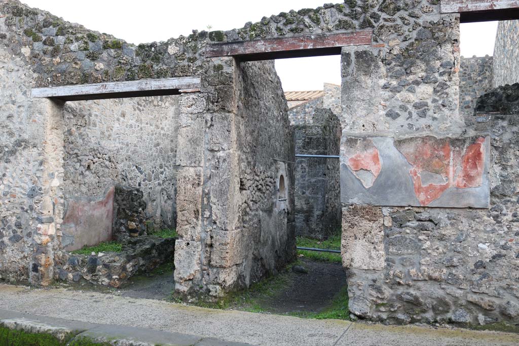 I.10.3 Pompeii. December 2006. Painted plaster on west side of entrance.