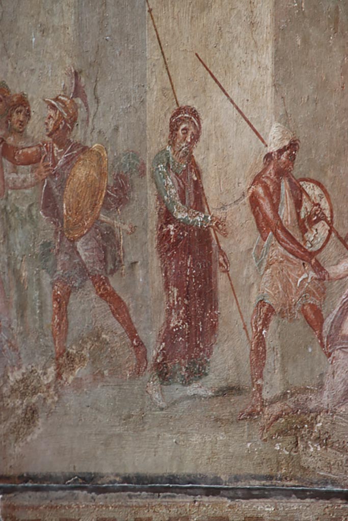 I.10.4 Pompeii. October 2023.
Room 4, north wall, detail from mythological scene showing Ajax dragging Cassandra from the Palladium before the eyes of Priam.
Photo courtesy of Klaus Heese.