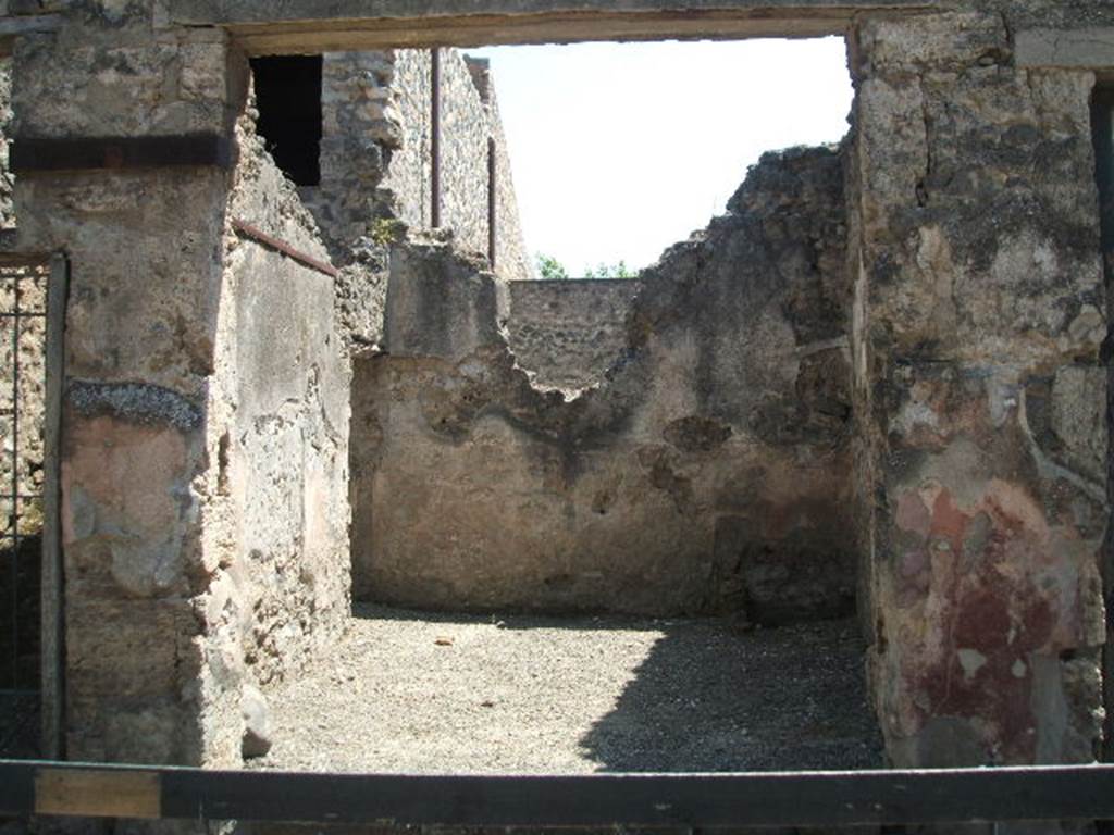 I.10.6 Pompeii. Workshop. December 2007. Small room to east of workshop. East wall, with waste pipe from upper level.