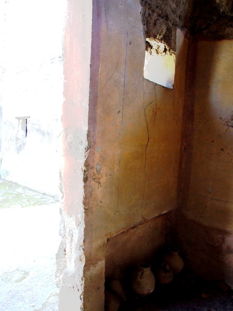 I.10.7 Pompeii. March 2009.  Room 3.  Cubiculum. South west corner.  Collection of Grondaia or antefisse fittili  (rainwater spouts for gutters).