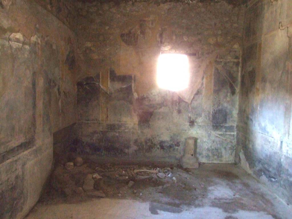 I.10.7 Pompeii. March 2009. Room 12, looking north in triclinium.  
According to Peters, the central pictures on the northern and eastern walls have almost completely disappeared.
The subject of the one in the centre of the northern wall was �Paris and Hermes on Mount Ida�.
See Peters, W.J.T. (1963): Landscape in Romano-Campanian Mural Paintings.The Netherland, Van Gorcum & Comp. (p.90)
