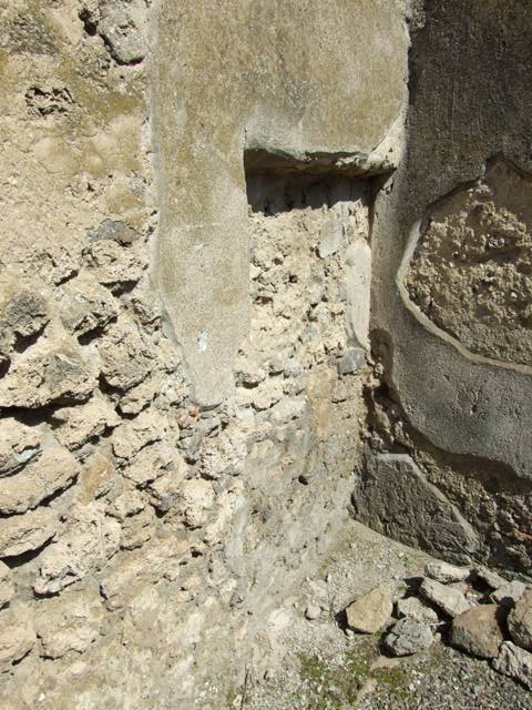 I.10.8 Pompeii. March 2009. Room 4, north wall of workroom, and window to room 3.