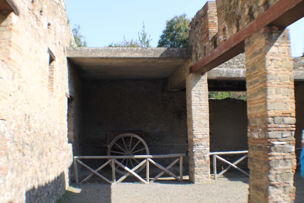 I.10.14 Pompeii. June 2010. Reproduction two-wheeled cart, with bronze fittings and iron fittings. Photo courtesy of Rick Bauer.