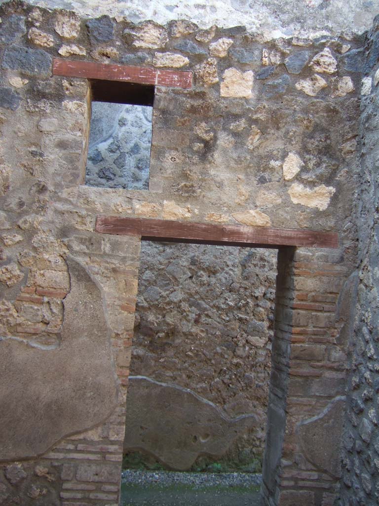 I.10.15 Pompeii. March 2009. Room on north side of entrance. Corridor looking south past rooms to I.10.4.