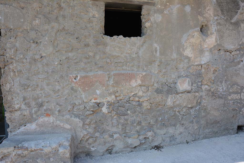 I.10.18 Pompeii. April 2017. Detail of remaining painted plaster on north side of entrance doorway.
Photo courtesy Adrian Hielscher.