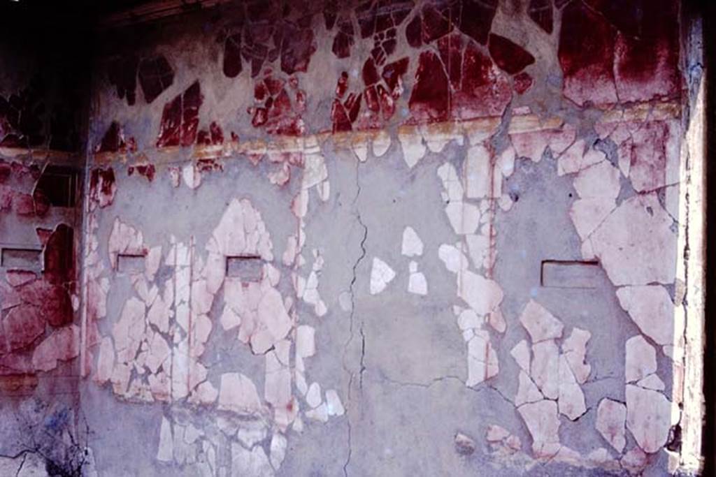 I.10.18 Pompeii. 1980 or 1983. North-east corner and east wall of room on upper floor. The small paintings have been removed.
Source: The Wilhelmina and Stanley A. Jashemski archive in the University of Maryland Library, Special Collections (See collection page) and made available under the Creative Commons Attribution-Non Commercial License v.4. See Licence and use details. J80f0559