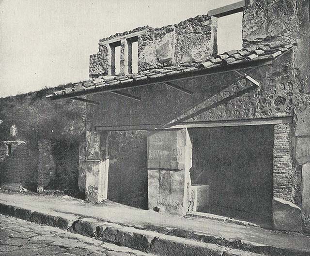 I.11.2 Pompeii. December 2007. Remains of painted plaster on west wall.  
