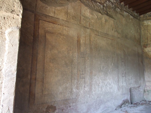 I.12.2 and I.12.1 Pompeii. March 2009. Room 7. Triclinium. East wall with door to corridor room 6.