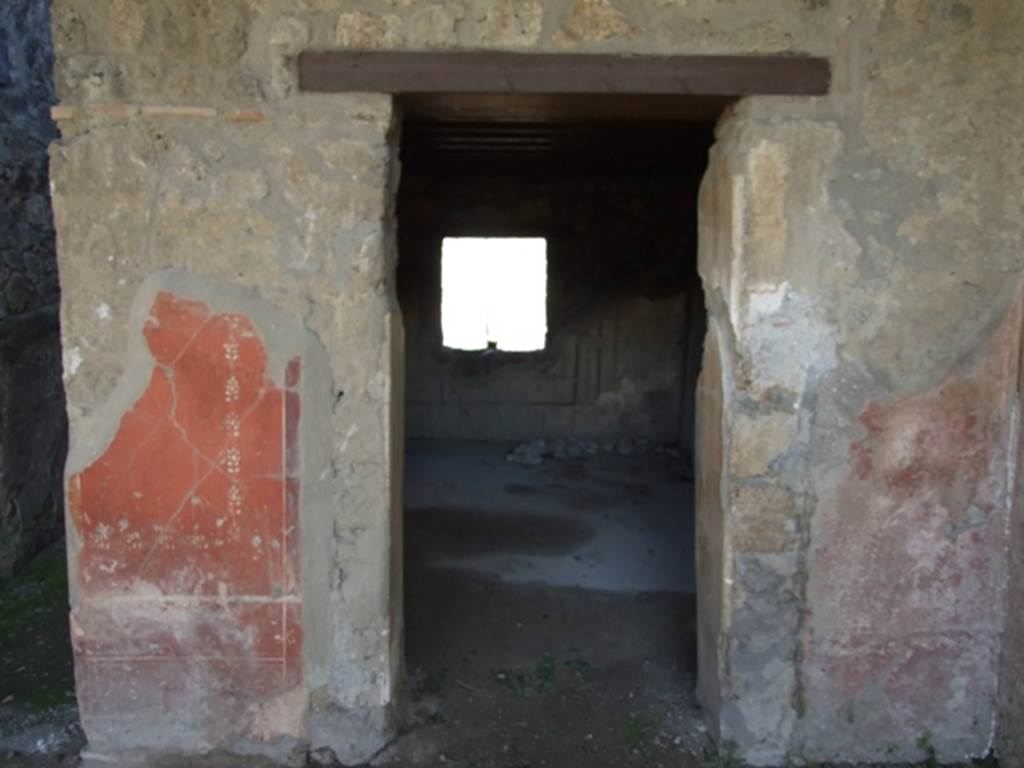 I.12.2 and I.12.1 Pompeii. March 2009. Room 7. Triclinium. Looking south across portico to garden area.