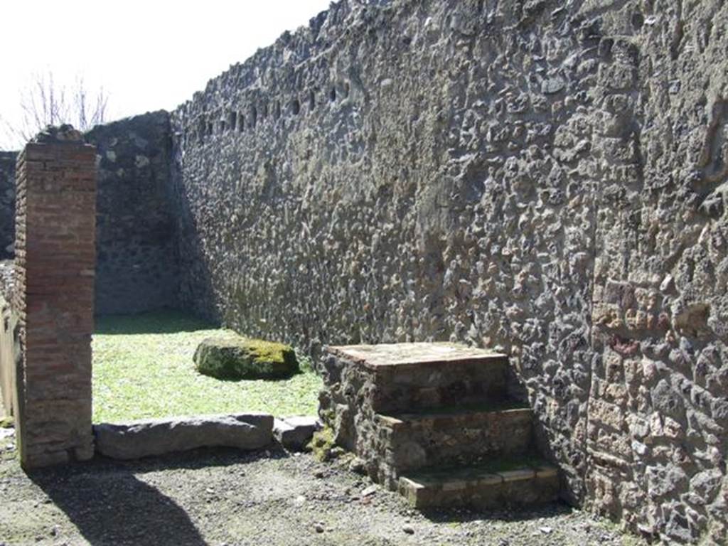 I.12.2 and I.12.1 Pompeii. March 2009. Room 11. Steps to upper floor, against west wall. Looking south towards room 12.