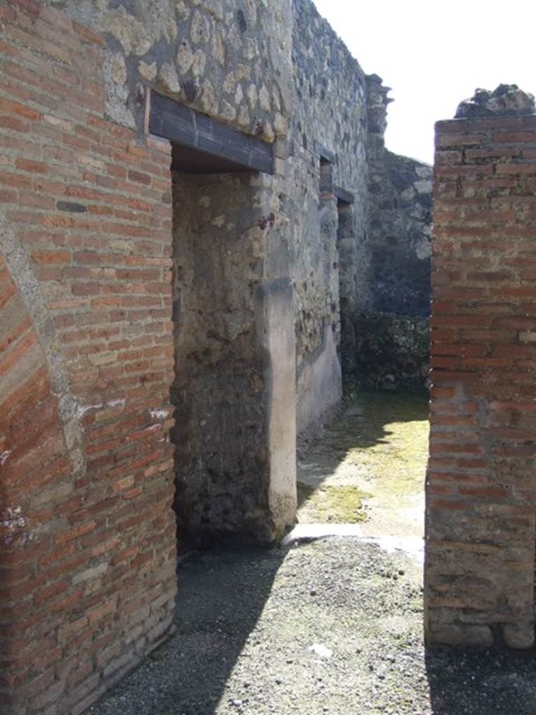 I.12.2 and I.12.1 Pompeii. March 2009. Doorway to room 13 (on left) and room 14 (ahead)