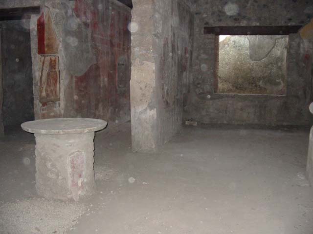 I.12.3 Pompeii. March 2009. Looking east from north passageway, to doorways of rooms 4 and 5.