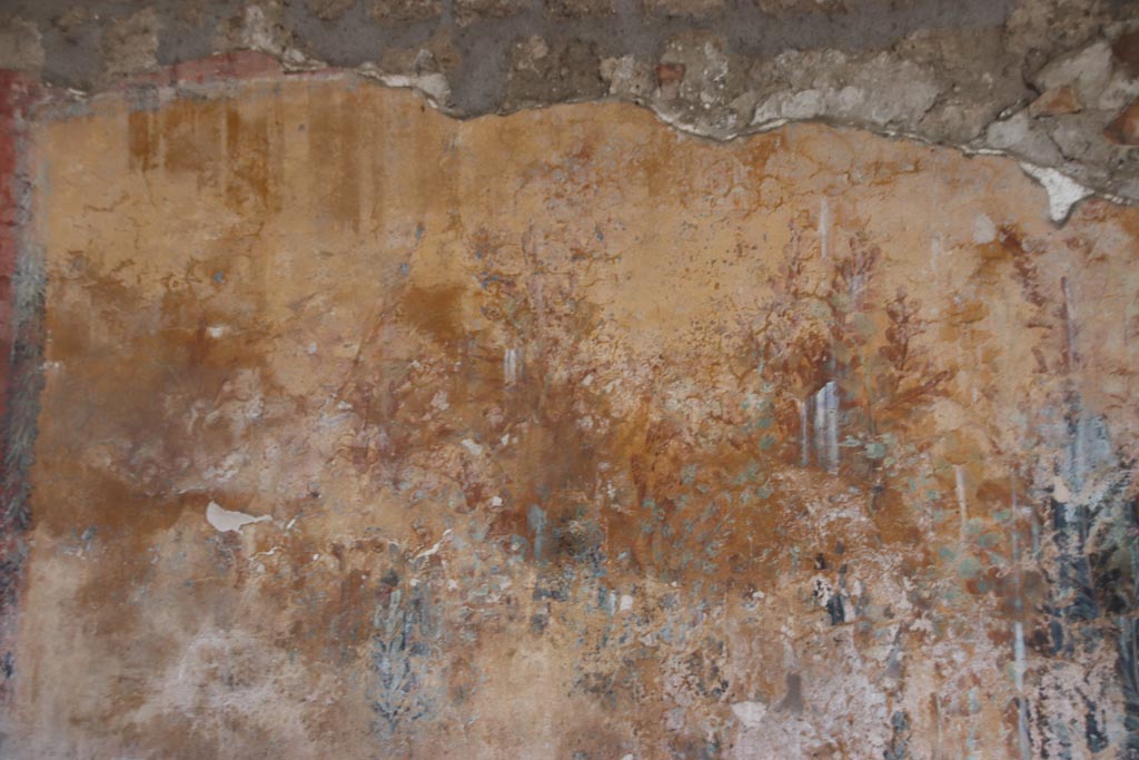 I.12.8 Pompeii. October 2022.
Peristyle 9, west side of north wall with detail of remaining garden painting. Photo courtesy of Klaus Heese.