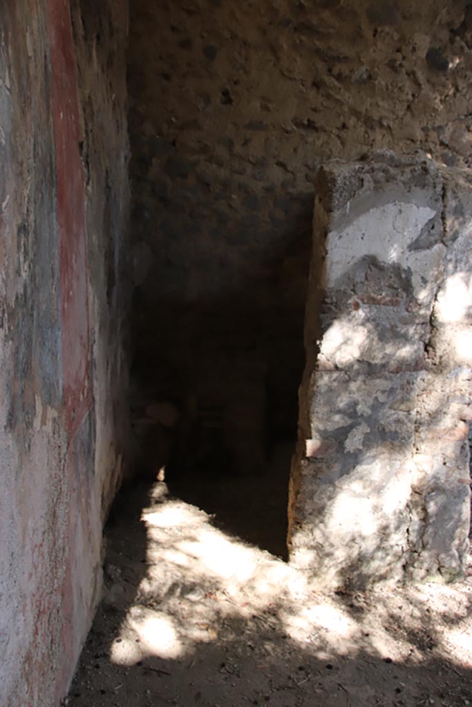 I.12.8 Pompeii. October 2022.
Doorway into room 12, latrine, in north-east corner of peristyle 9. Photo courtesy of Klaus Heese.
