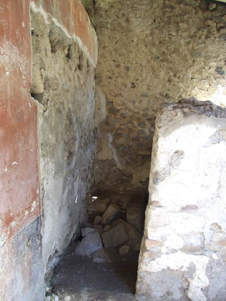 I.12.8 Pompeii. March 2009. Room 9. North east corner of peristyle garden. Doorway to room 12.