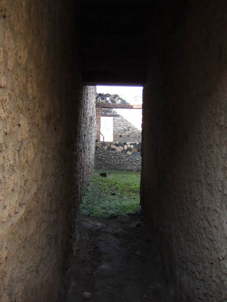 I.12.9 Pompeii. December 2007. Looking north to garden at I.12.14, across room in north-west corner.
