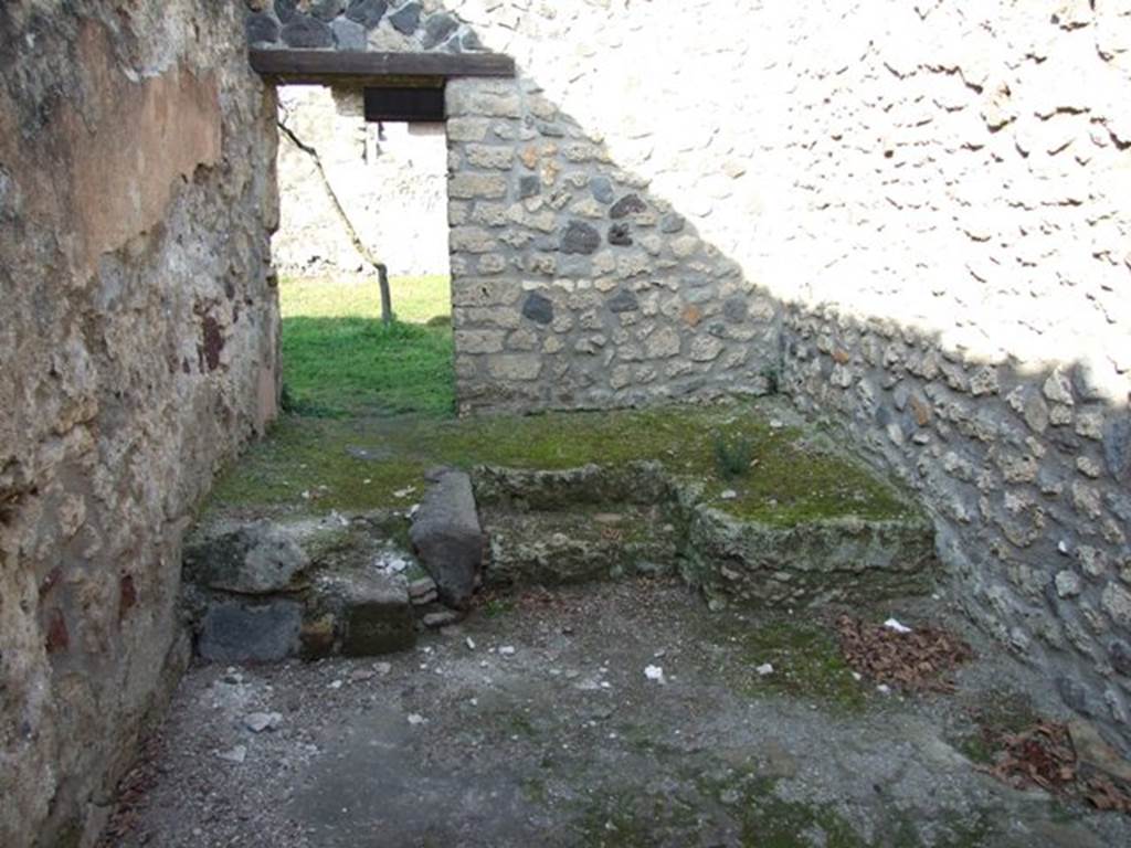 I.12.9 Pompeii. December 2007. Looking south across atrium from tablinum area, towards entrance, on right. On the left can be seen the niches in south-east corner of atrium, as well as a doorway and window to the triclinium. According to Wallace-Hadrill, this room had faded but elegant white-ground style-III decorations. See Wallace-Hadrill, A. (1994). Houses and Society in Pompeii and Herculaneum. Princeton Univ.Press, (p.196/7)