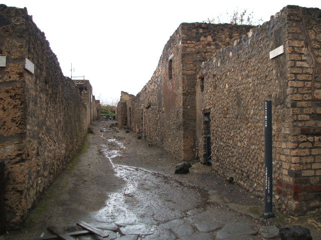 I.12.13 Pompeii. December 2007. Down-pipe from upper floor on north side of entrance.