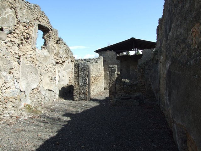 I.12.15 Pompeii. March 2009. Steps to outside Triclinium, at east end of corridor.