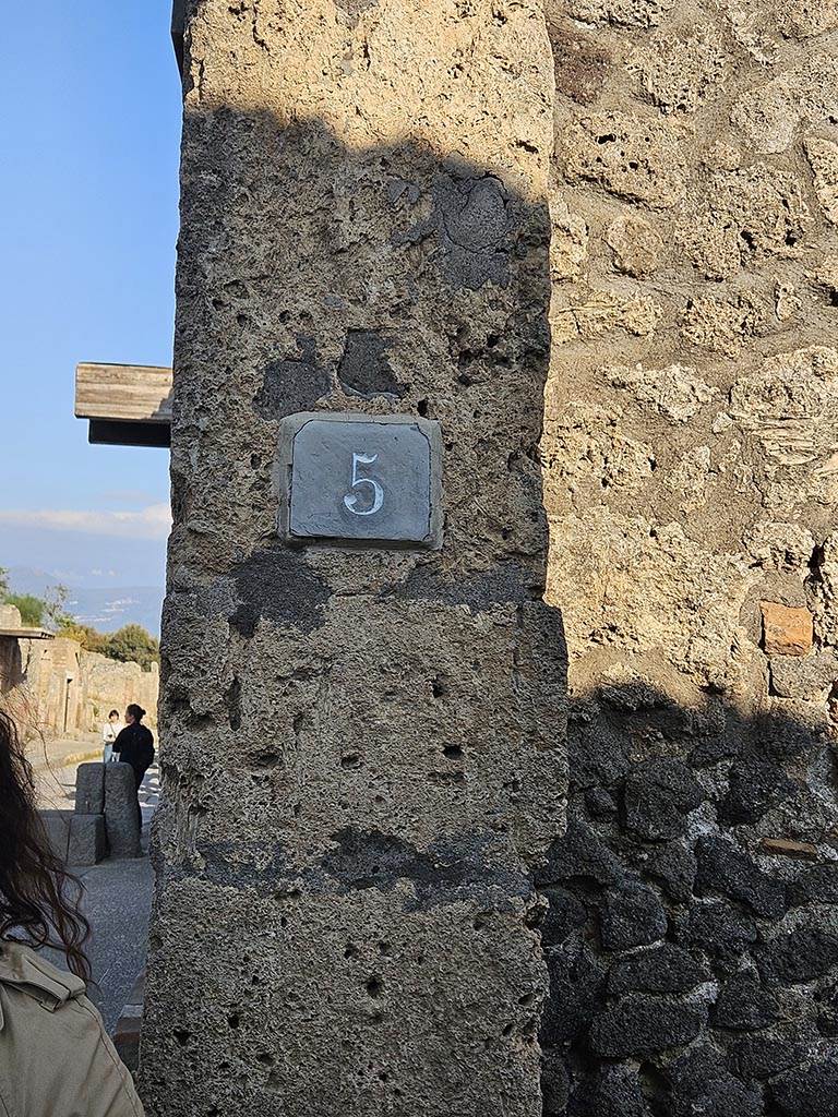 I.13.5 Pompeii. November 2024.
Identification number-plate on east side of entrance doorway. Photo courtesy of Annette Haug.