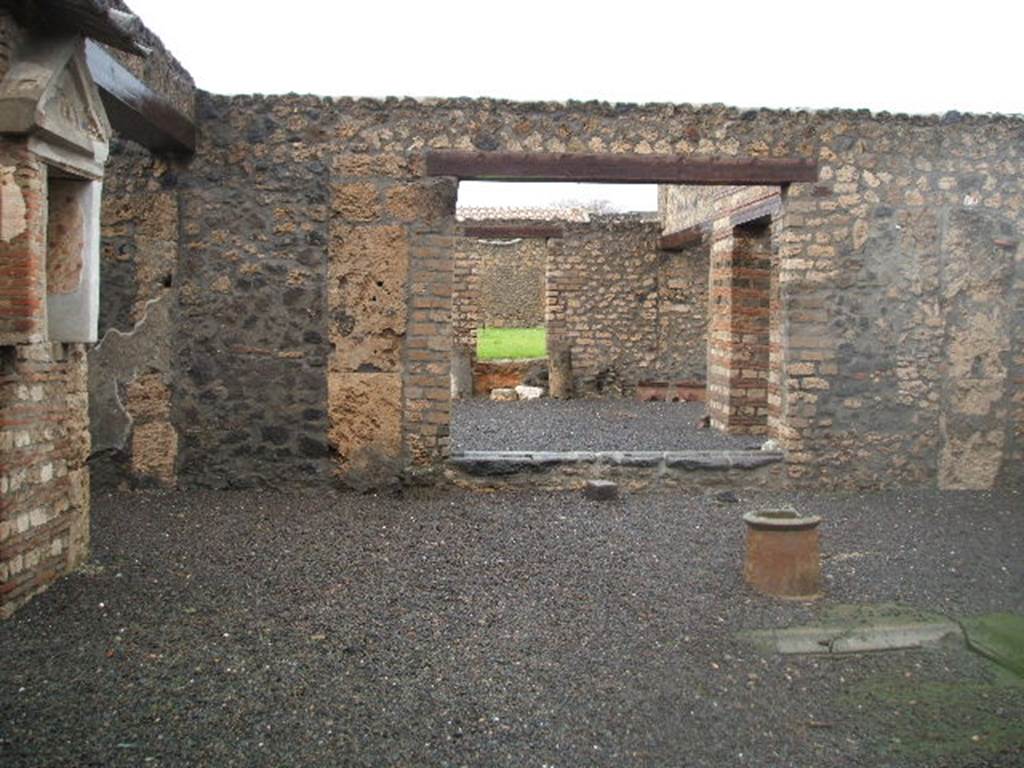 I.13.12 Pompeii. December 2004. Looking north across Atrium without Tablinum, with doorway to small garden or yard.