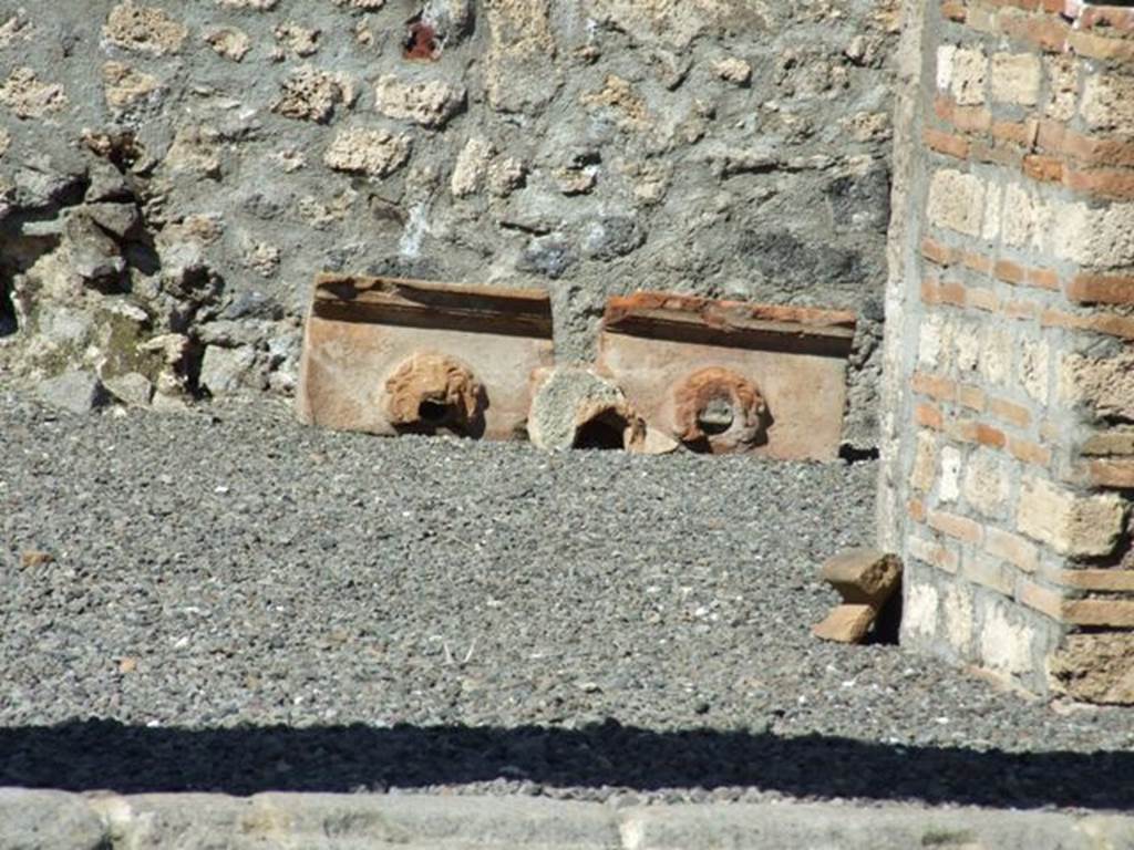 I.13.12 Pompeii. March 2009. Remains of Grondaia, or Antefisse fittili, or Sima, or water spouts.