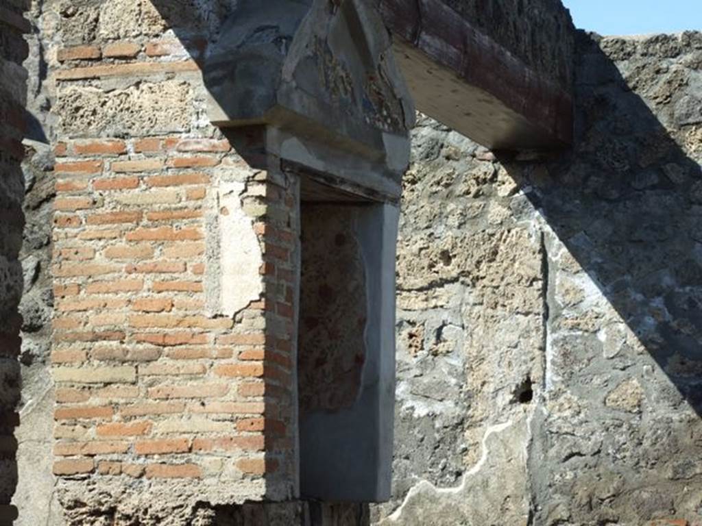 I.13.12 Pompeii. March 2009. West wall of atrium, south of the Ala. Aedicula Niche Lararium, with frescoed white walls.