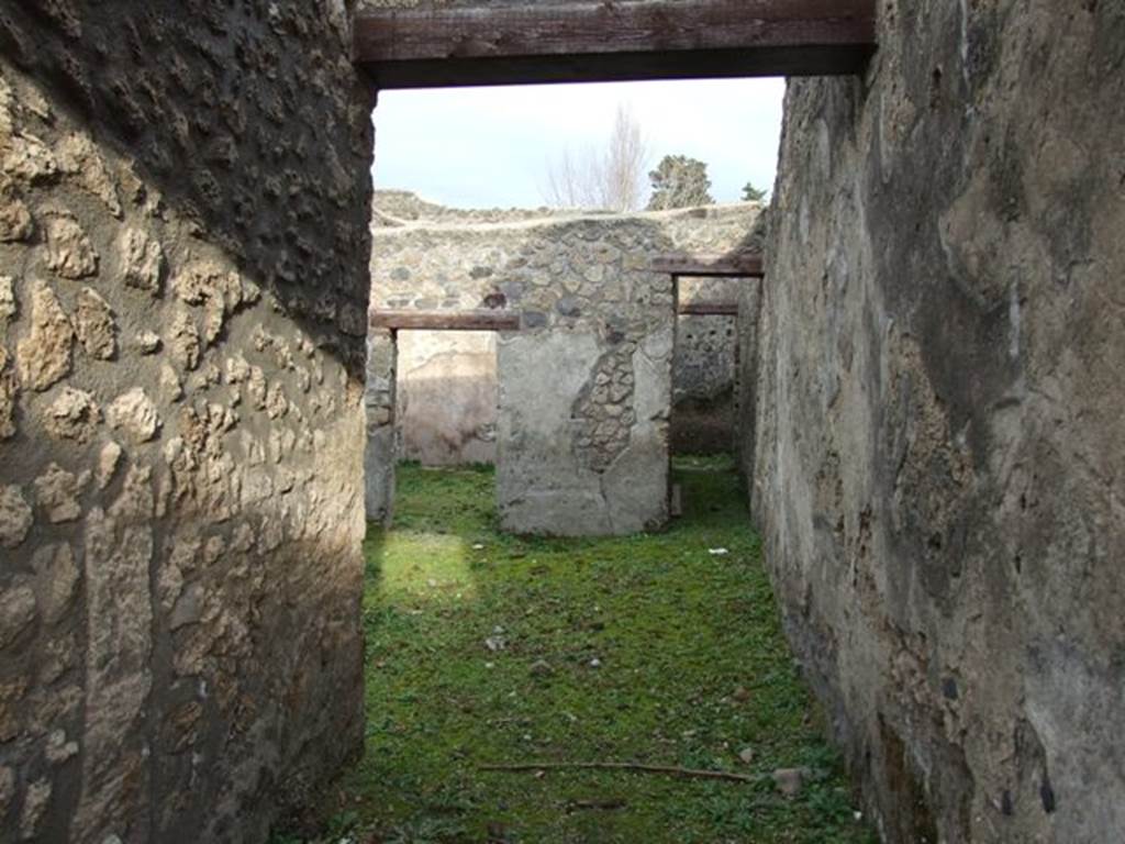 I.13.15 Pompeii. March 2009. Room on north side of entrance. Looking east from doorway from room across central courtyard. 

 