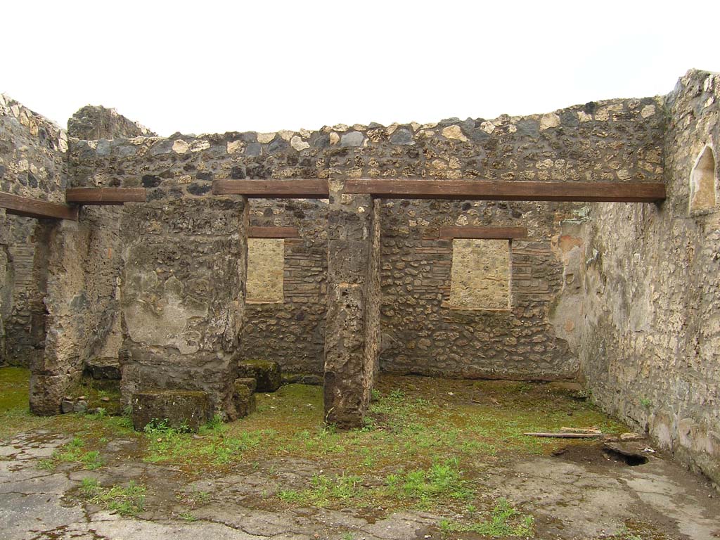 I.14.2 Pompeii. July 2008. Looking south across atrium to base of stairs (left) to upper floor. Photo courtesy of Guilhem Chapelin. 
The group of rooms aligned in the southern part of the house was surmounted by a floor. From the atrium, in fact, this level was reached thanks to a staircase leaning against the eastern wall of room D (Fig. 159). From this staircase remains only the start, constituted of two rough masonry steps (l .: 0,72 m). However, the traces that remain partially on the travertine blocks composing the wall indicate that a wooden staircase followed these two steps. In 1958, the excavators also reported the presence of charred wood at the bottom of the staircase, a probable remnant of this development (see Fig. 156).
Voir Chapitre 2 : L�atelier de fabrication de nattes de la via di Nocera (I 14, 2) in Magali Cullin-Mingaud, 2010. La vannerie dans l'Antiquit� romaine: Collection du Centre Jean B�rard 35. Paris. Centre Jean Berard, p. 129-171, fig. 159, fig. 156.
https://books.openedition.org/pcjb/706
