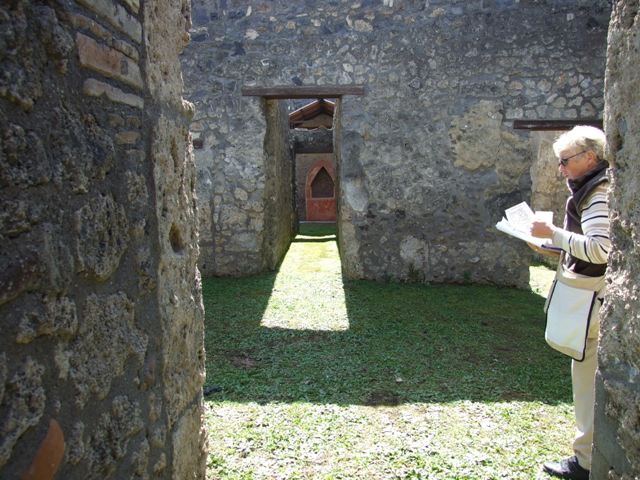 I.14.7 Pompeii. March 2009. South east corner of atrium, with door to Cubiculum and corridor to rear.