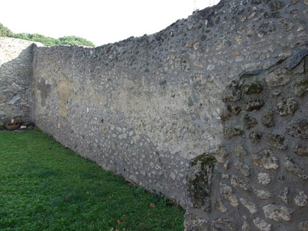 I.14.9 Pompeii. December 2007. South wall with latrine and kitchen wall to right. According to Eschebach, the kitchen and latrine were on the right of entrance numbered 1.14.9.  See Eschebach, L., 1993. Geb�udeverzeichnis und Stadtplan der antiken Stadt Pompeji. K�ln: B�hlau. (p.73)
