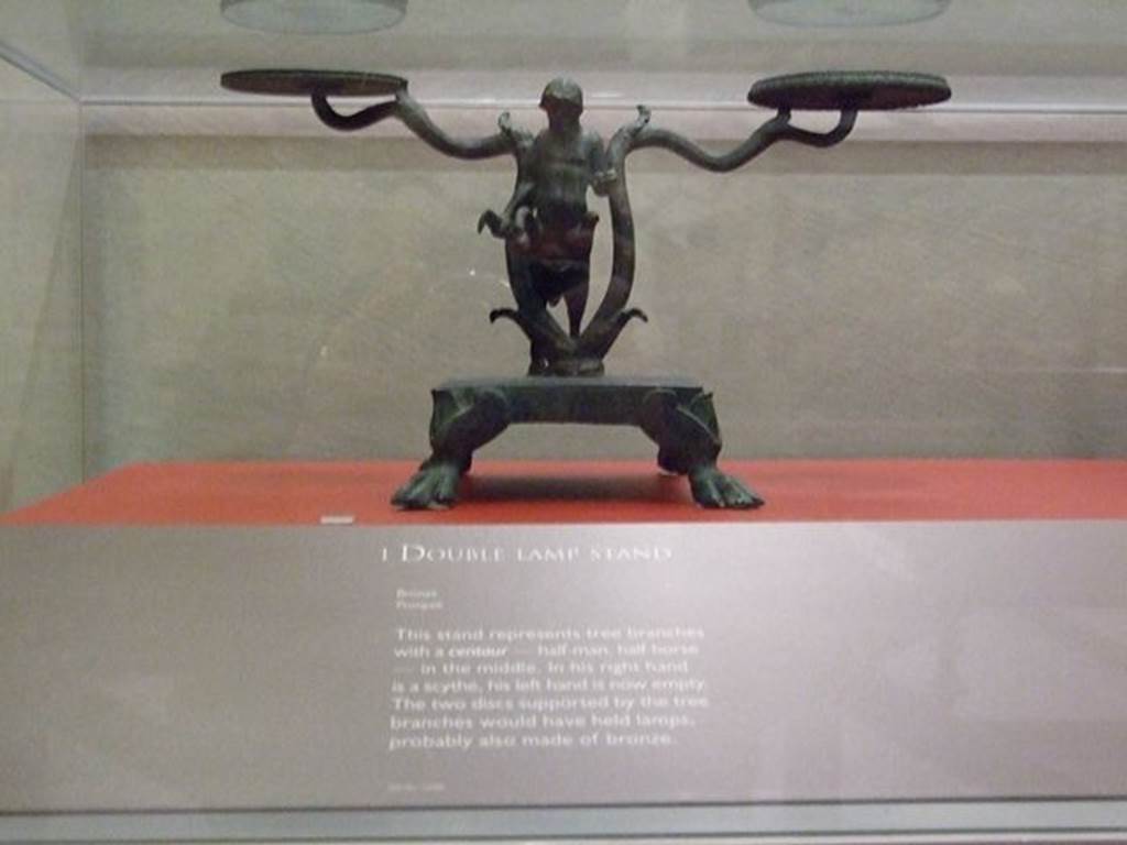 I.14.9 Pompeii.  Bronze double lamp stand in the shape of a tree with a centaur in the centre. SAP 12088. Photographed at �A Day in Pompeii� exhibition at Melbourne Museum.  September 2009.