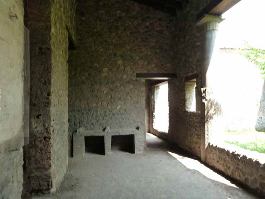 I.15.3 Pompeii. May 2010.
Looking east along north portico 10 of peristyle 13. The doorway on the left leads to room 3 and entrance I.15.2.