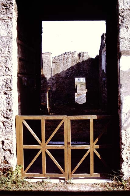 I.15.3 Pompeii. December 2004. Room in north-west corner. Detail of stucco on upper north and west walls.
