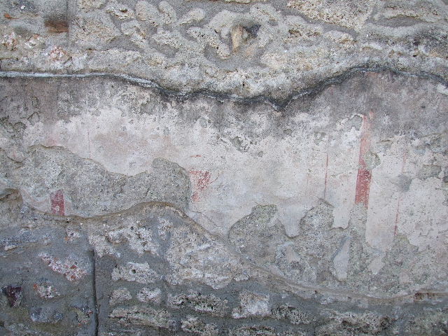 I.16.3 Pompeii. December 2006. North wall in lararium. Detail of painting of Minerva with sacrifice in a dish in her right hand held over a round altar.