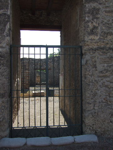 I.16.4 Pompeii. December 2006. Looking south across atrium towards rear of house, towards triclinium, tablinum and corridor to garden.