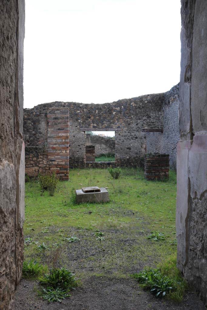 I.16.4 Pompeii. December 2006.Lararium and doorway to cubiculum in north-west corner of atrium.