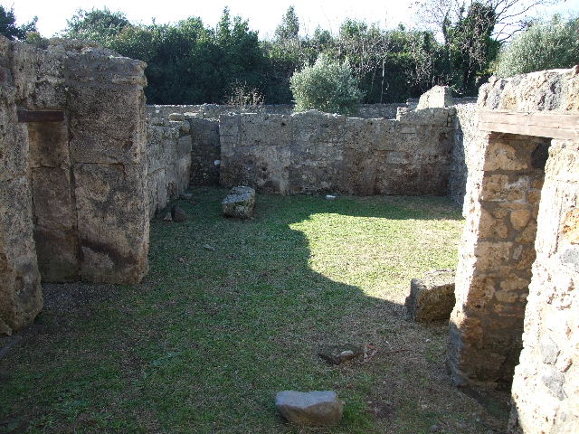 I.16.7 Pompeii. December 2006. Looking east across yard towards entrance doorway.