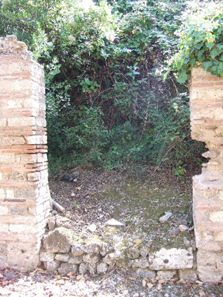 I.19.1 Pompeii. September 2005. Entrance doorway, looking south.
According to Hunink, graffito naming Actius was found on the counter of I.11.2 [=I.19.2]
<B=H>onus deus hic (h)abitat in do/mo / Act(i)      [CIL IV, 8417]
He translates this as �A good god lives here in the house of Actius�.
See Hunink, V., 2011. Gl�cklich ist dieser Ort!: 1000 Graffiti aus Pompeji. Stuttgart: Philipp Reclam, p. 60 no. 101.
