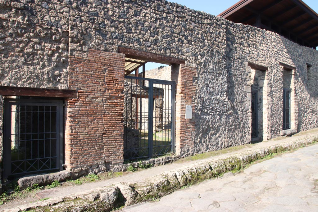 I.20.1, on left, followed by I.20.2, in centre, Pompeii October 2022.
Looking towards entrance doorways on west side of Via di Nocera. Photo courtesy of Klaus Heese.