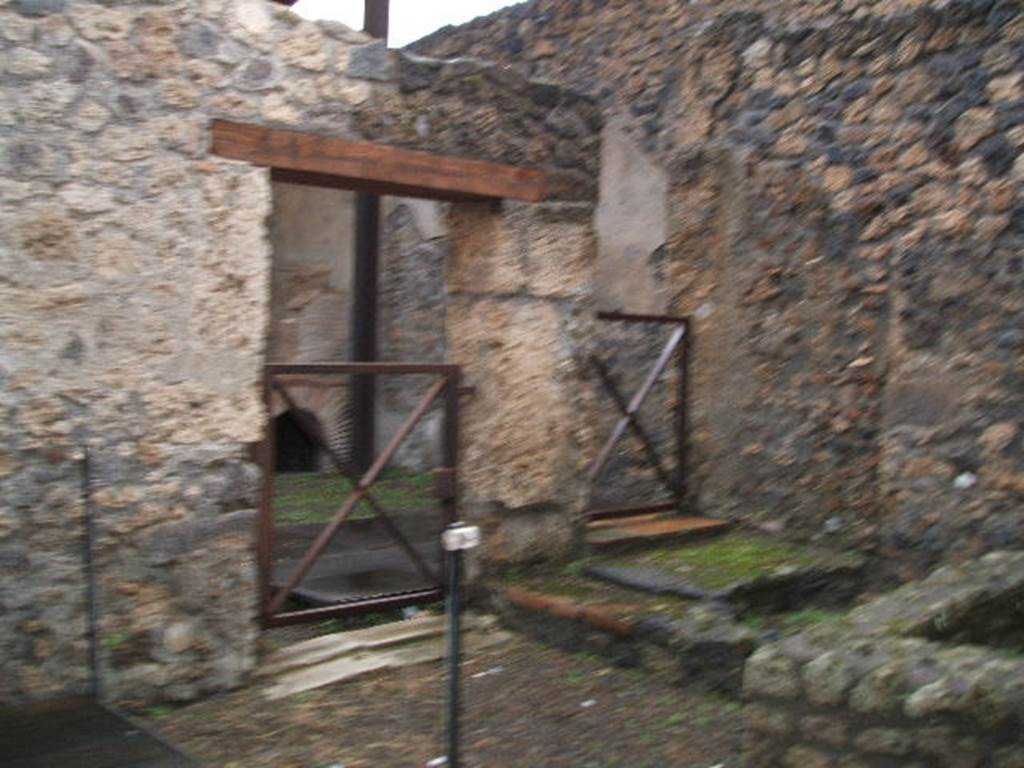I.20.2 Pompeii. December 2004. Looking north-west towards doorway to I.20.3 from I.20.2.