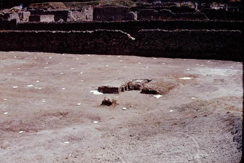 I.22 Pompeii. 1974. Looking east across site, with triclinium and markers for root-cavities. Photo by Stanley A. Jashemski.
Source: The Wilhelmina and Stanley A. Jashemski archive in the University of Maryland Library, Special Collections (See collection page) and made available under the Creative Commons Attribution-Non Commercial License v.4. See Licence and use details. J74f0467