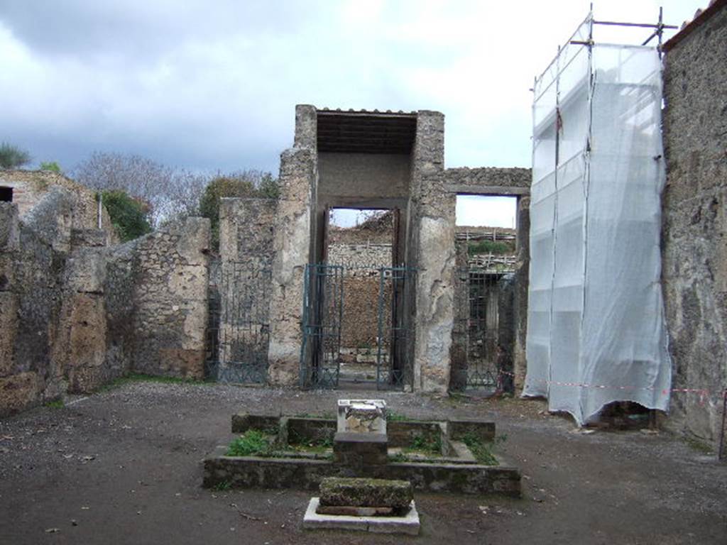 II.2.2 Pompeii. December 2005.
Room 2, looking north across atrium to entrance. The doorway to room 3 is behind scaffolding.