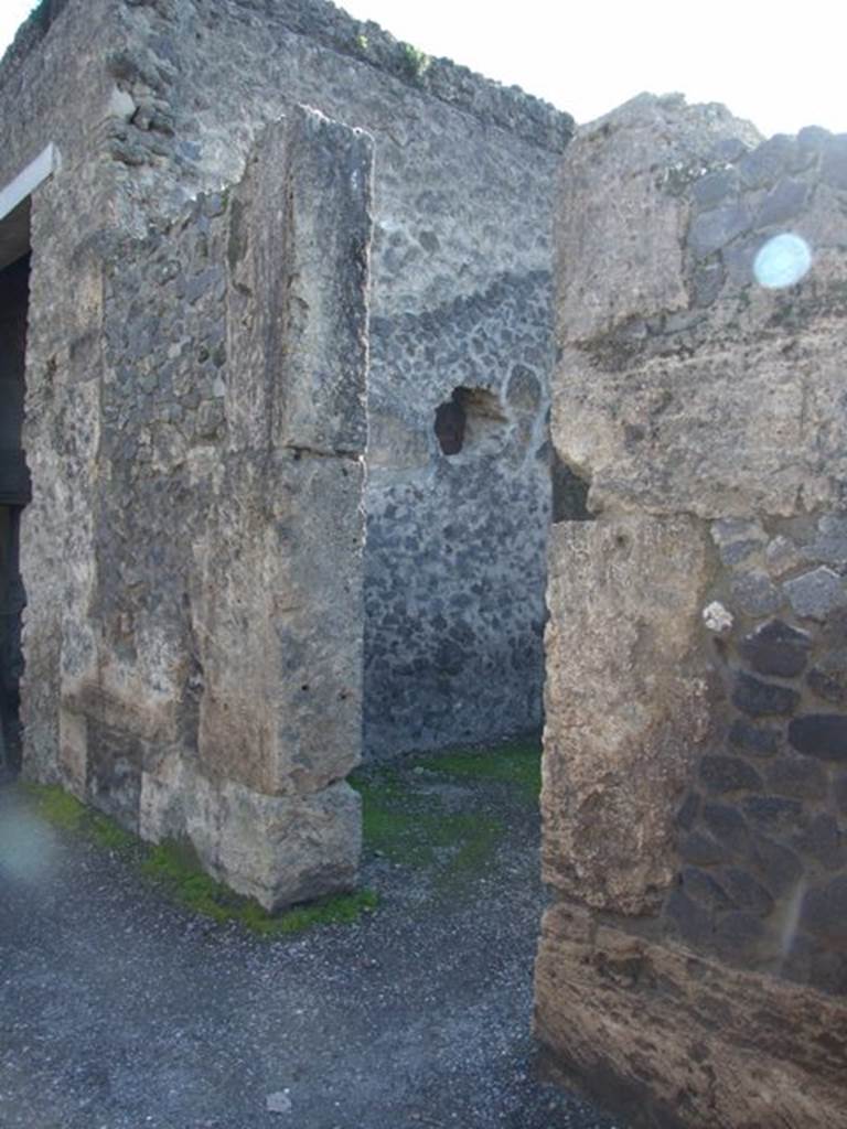 II.2.2 Pompeii. March 2009. Doorway to room 3, cubiculum on west side of atrium. As a result of the bombing of 19th September 1943, nearly all of the IV Style decoration of the central cubiculum was lost. The decoration from the north and west wall, and part of the south wall, were destroyed. In this cubiculum badly damaged were two figured paintings. One of a female, possibly of the wife or daughter of Loreius, according to Della Corte. The other was the The rape of Europa, only partially damaged and restored. See Garcia y Garcia, L., 2006. Danni di guerra a Pompei. Rome: L’Erma di Bretschneider. (p.45-47)