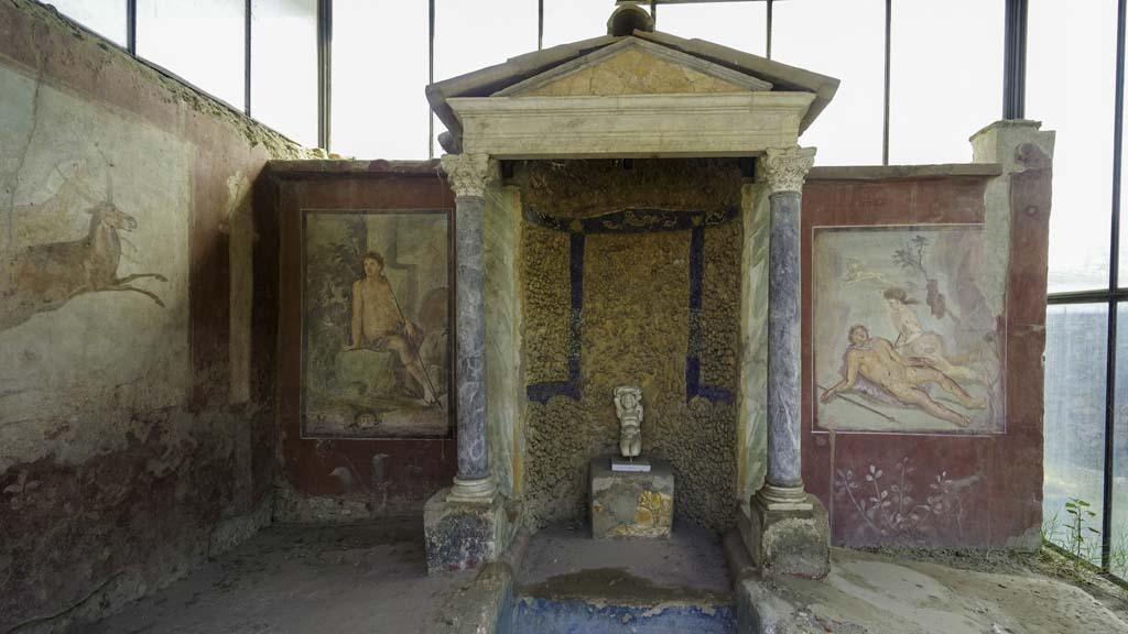 II.2.2 Pompeii. August 2021.
Room “k”, looking east towards summer dining room with biclinium, water feature and painted decoration, at east end of upper euripus.
Photo courtesy of Robert Hanson.