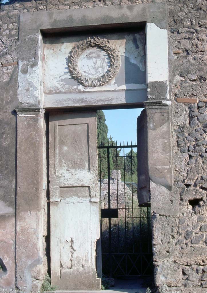II.2.4 Pompeii. August 1976. Entrance doorway with plaster cast of doors.
Photo courtesy of Rick Bauer, from Dr George Fay’s slides collection.
