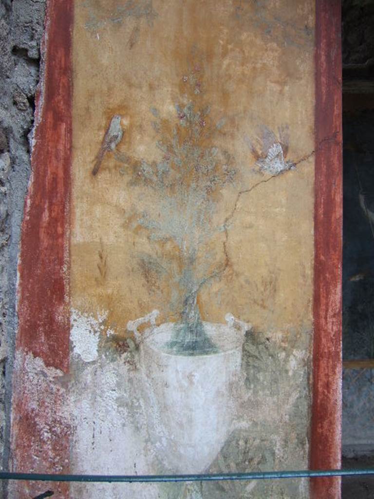 II.3.3 Pompeii. December 2006. Room 17, exterior north side of Sacellum.
Wall painting of goblet with jet of water and birds.