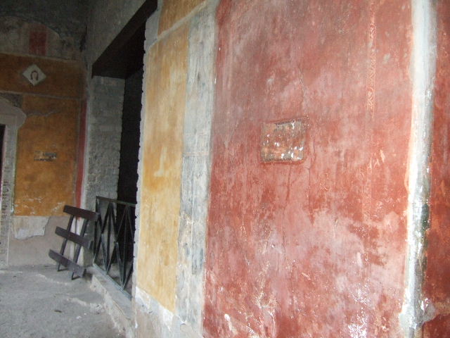 II.3.3 Pompeii. March 2009. Room 11, North Portico. Wall between doorways to Room 5 and Room 12.